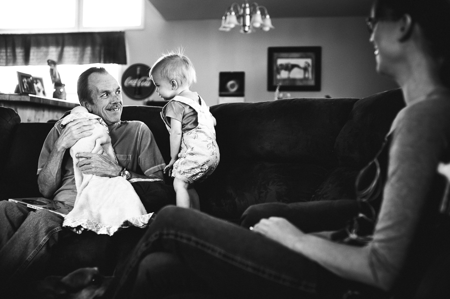 grandpa and girl playing baby