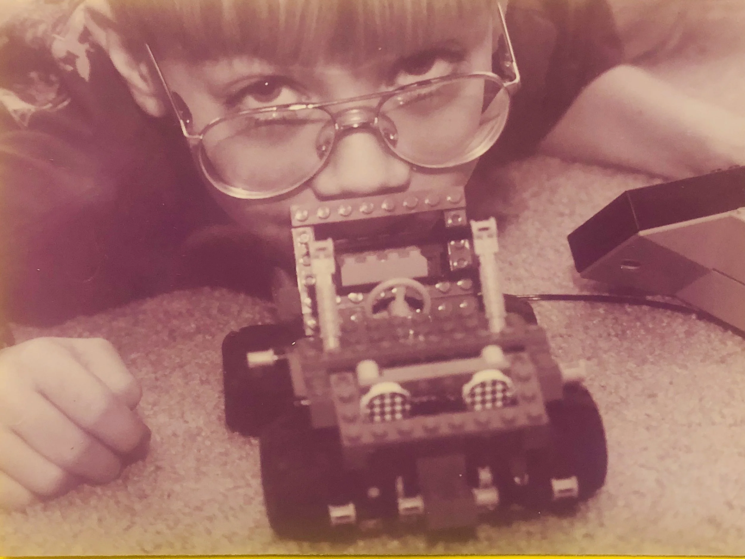 A small child with Legos.