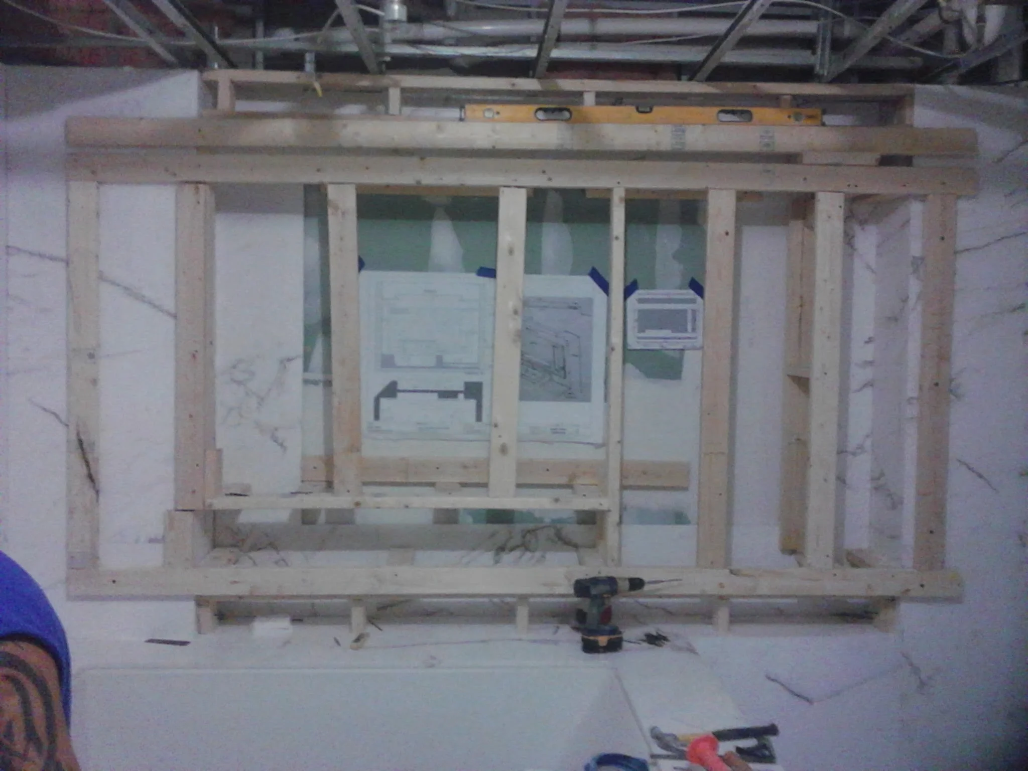  Floating 3D false wall with niche and rap around LED lighting. Material white vein marble 