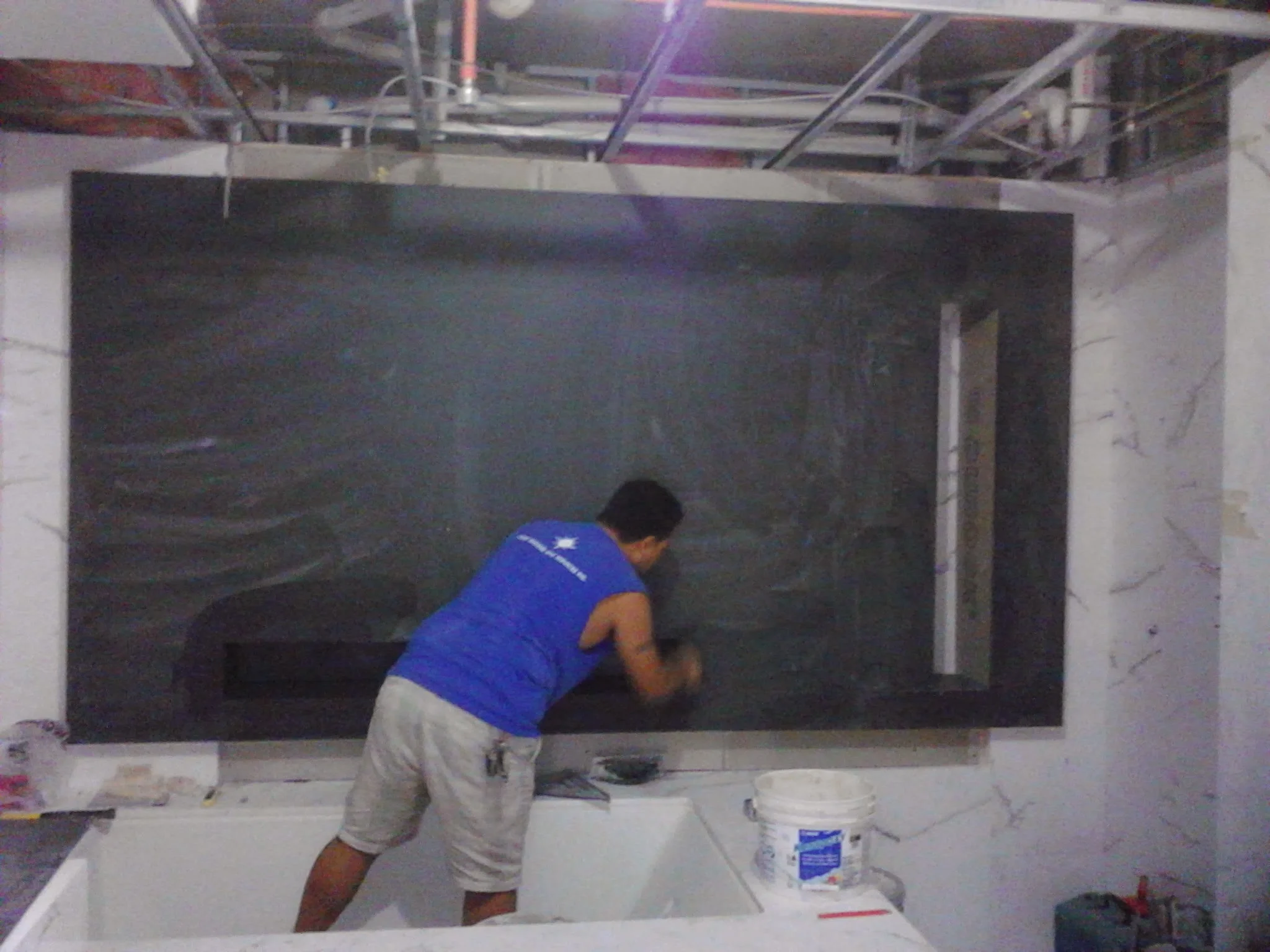  Floating 3D false wall with niche and rap around LED lighting. Material white vein marble 