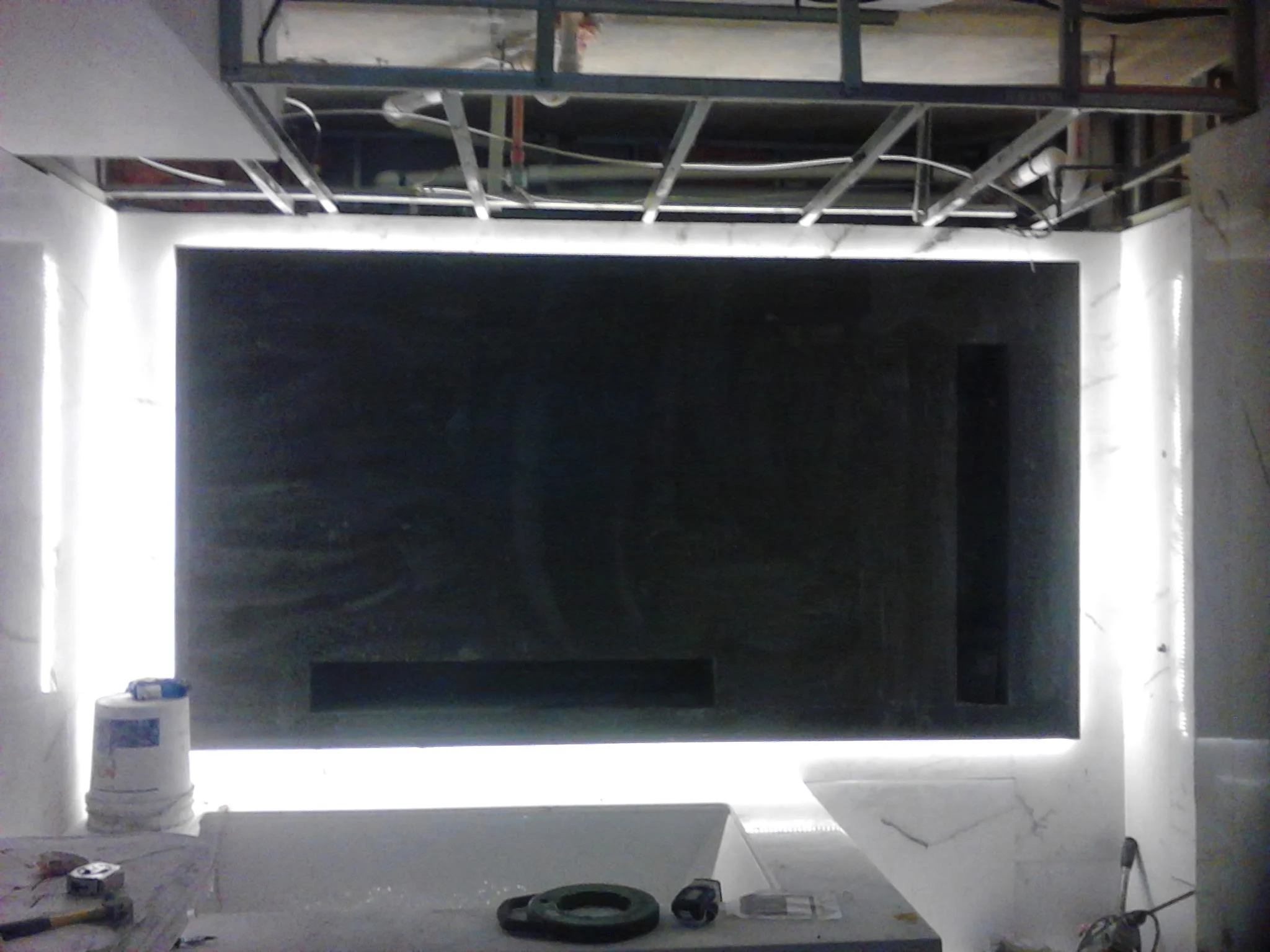  Floating 3D false wall with niche and rap around LED lighting. Material white vein marble 