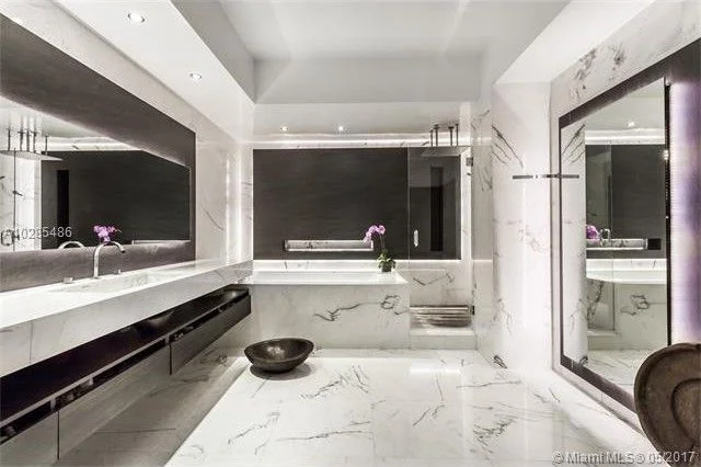  Floating 3D false wall and mirror with niche and rap around LED lighting. Material white vein marble. finish product 