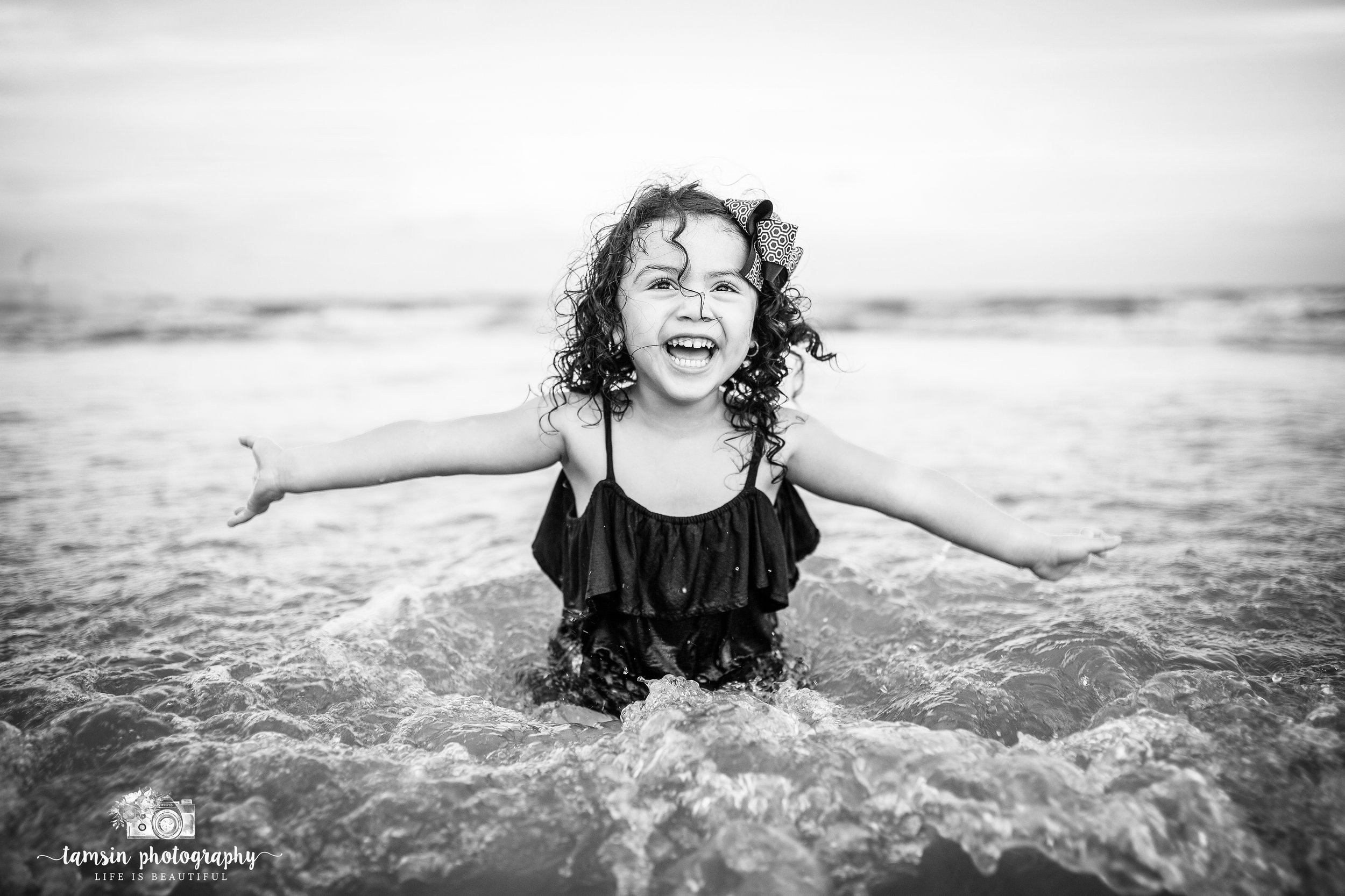 Black and white photography kids childhood florida beach.jpg