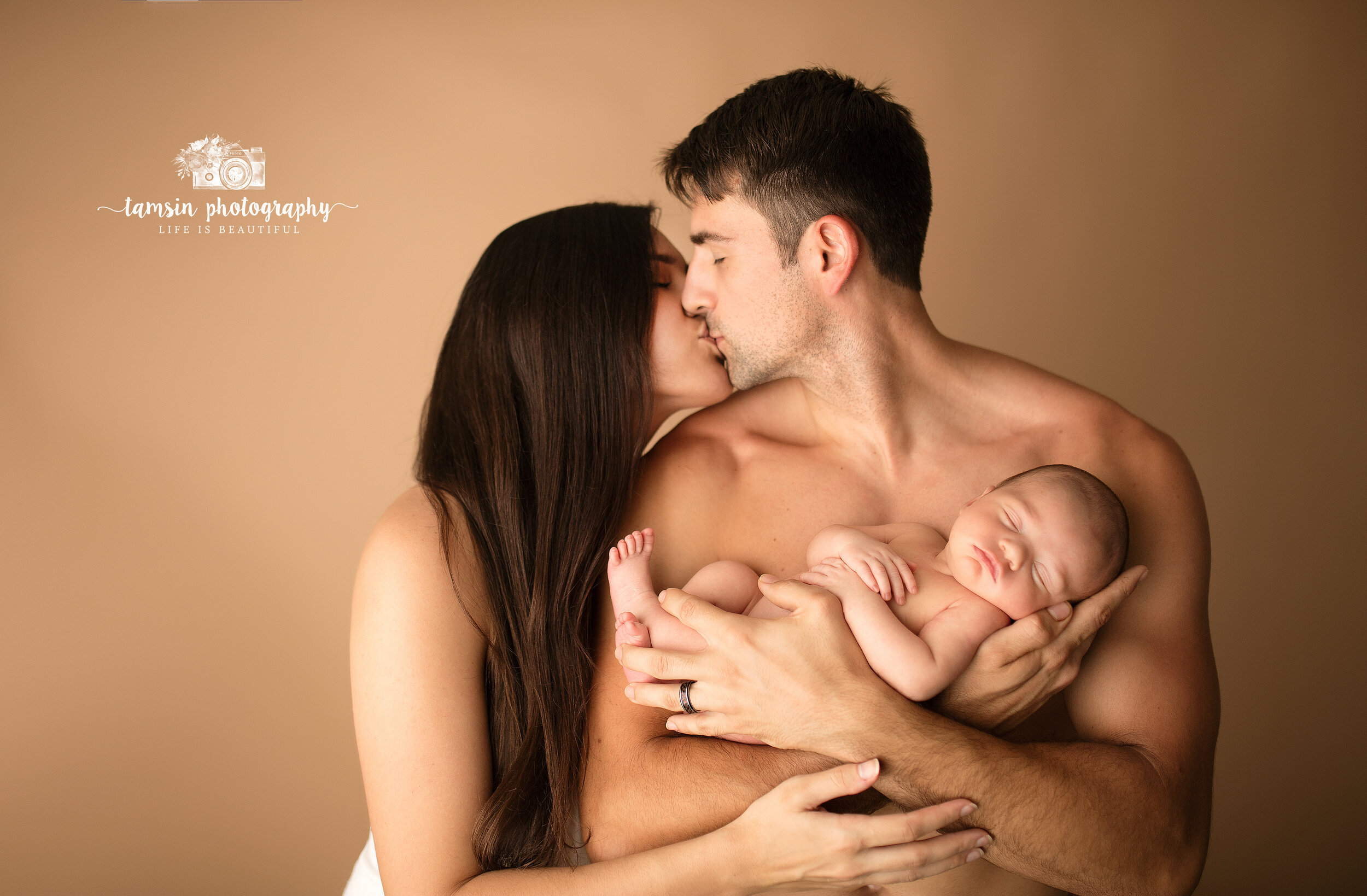 Newborn and Parents Posing.jpg