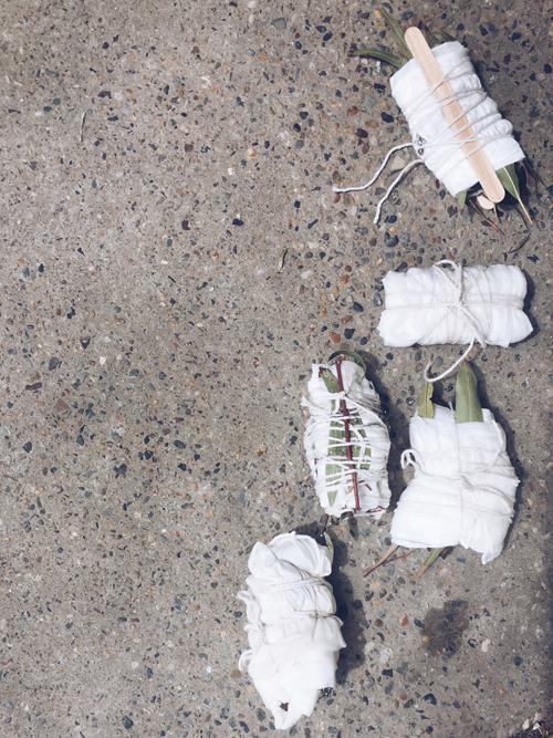 A few of the workshop attendees beautiful bundles gathered on the pavement outside the gallery, awaiting the dye pot.