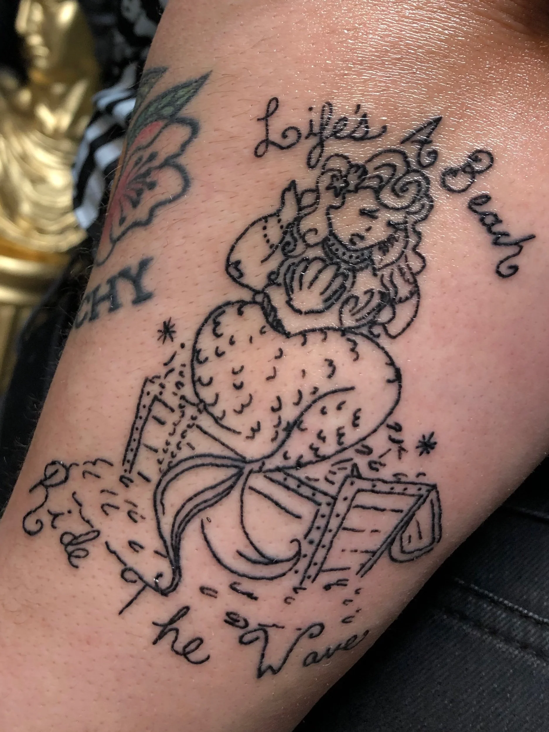 tattoo lifes a beach.jpeg