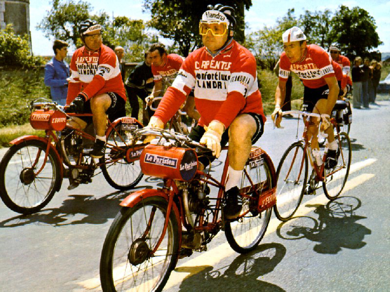 Both pictures are of Herman Van Springel in various Bordeaux Paris Classics. Each cyclist had two dernys in case one broke down during the race (not uncommon). Bordeaux Paris was 680k in length (with just one brief rest stop for a change of clothing) with the last 250k behind the derny. The derny driver was usually an ex professional & bigger was very much better. Dernys are always red for reasons unknown.