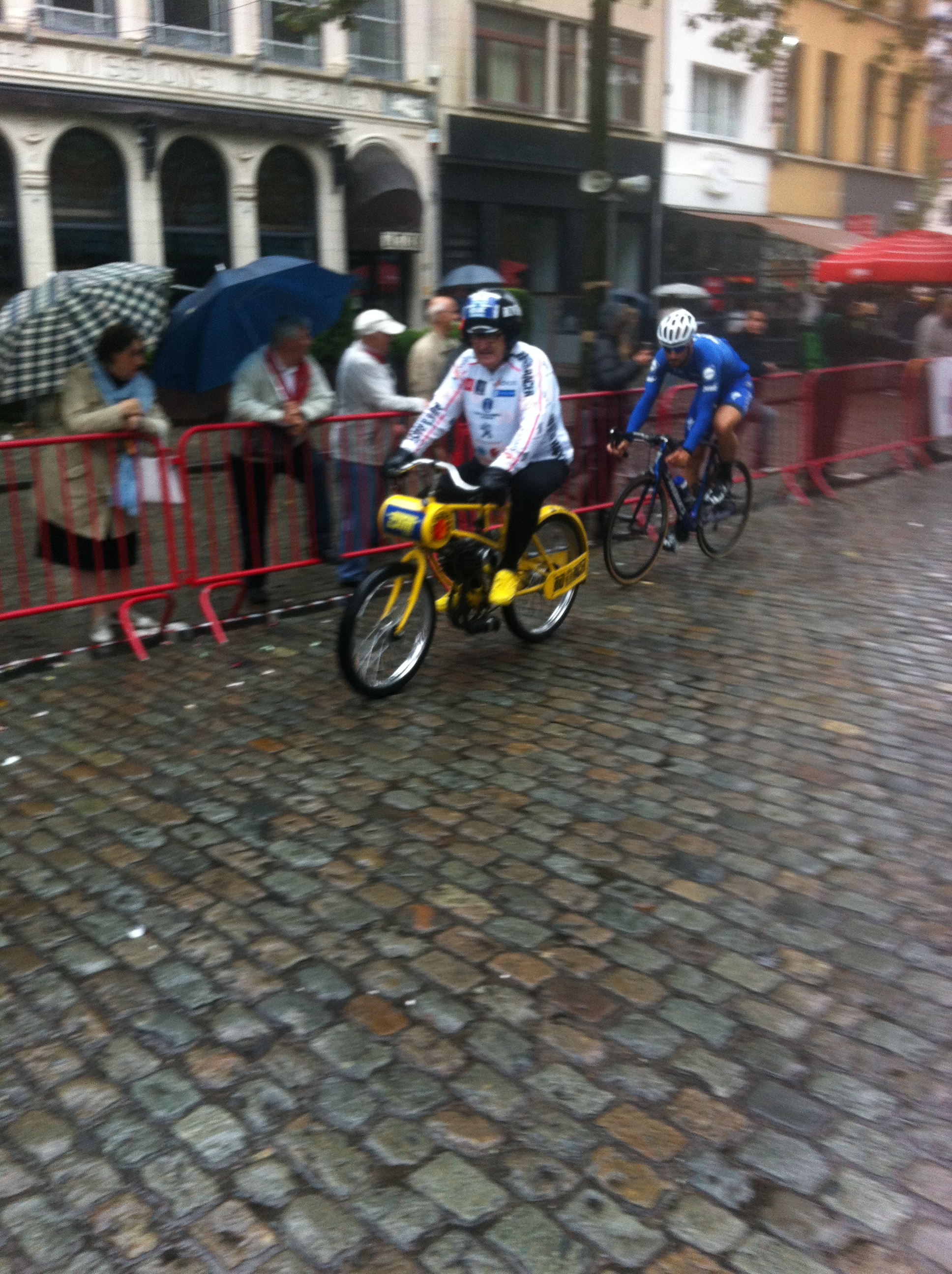 Tom Boonen approaches the greasy left hand corner in never ending Antwerp rain
