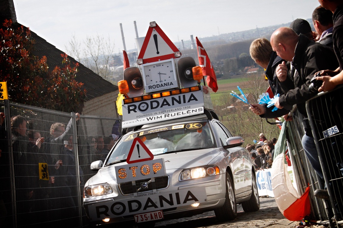 The Belgian take on what a cycle race lead car should look like (Tour of Flanders 2016) ... you would be in no doubt that something is fast approaching ... multiple signs, blaring music, flashing lights, a Rodania clock, sponsorship and a few flags ... under all of that is a car