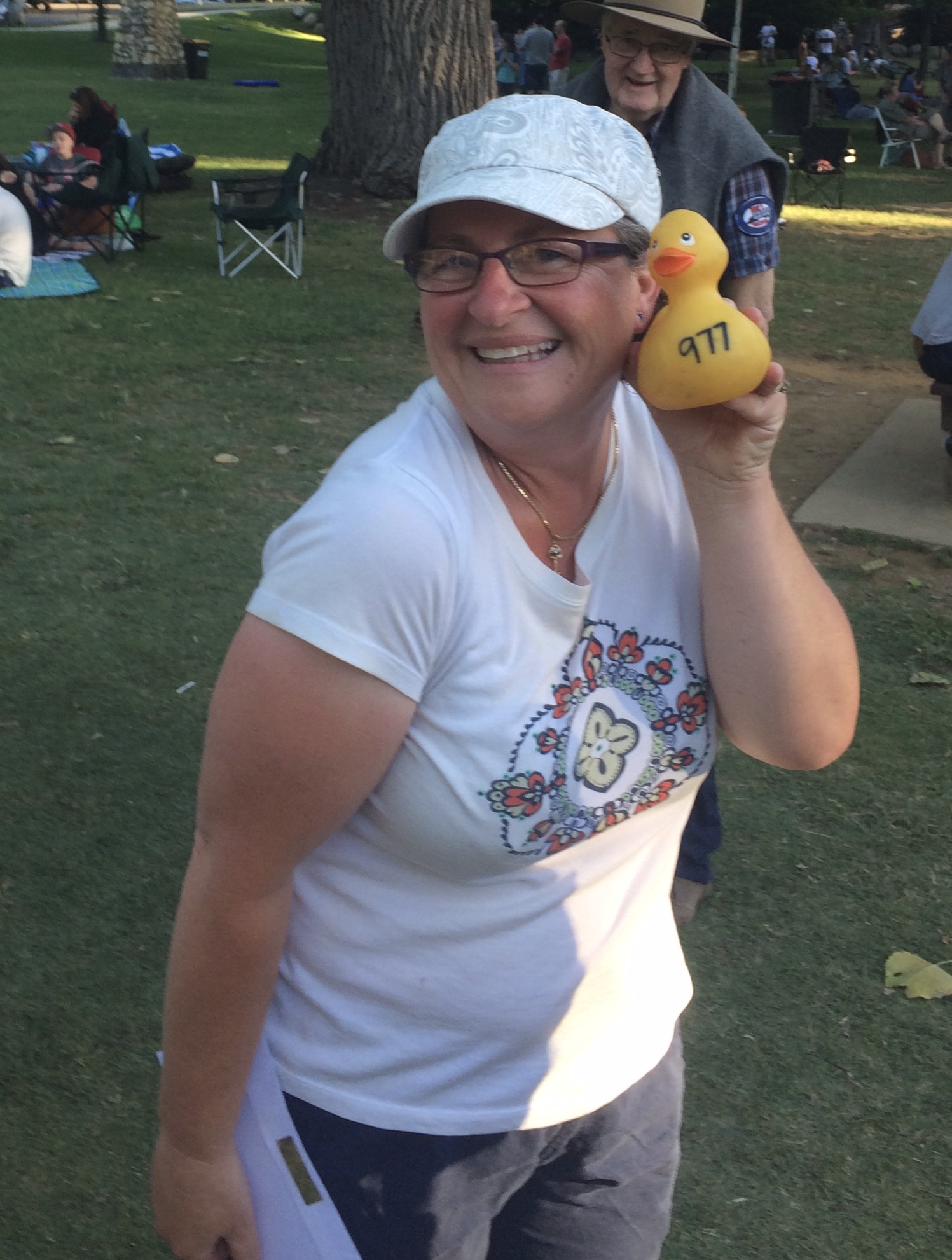 Michelle Tarlington purchased a $5 raffle ticket in the Annual Bright Duck Race. Several thousand plastic ducks are dropped off the Morse Creek Bridge in central Bright with the first duck to cross the finish line earning $1,000 for one happy camper ... Duck # 977 suitably took the sprint for one very happy camper ... 