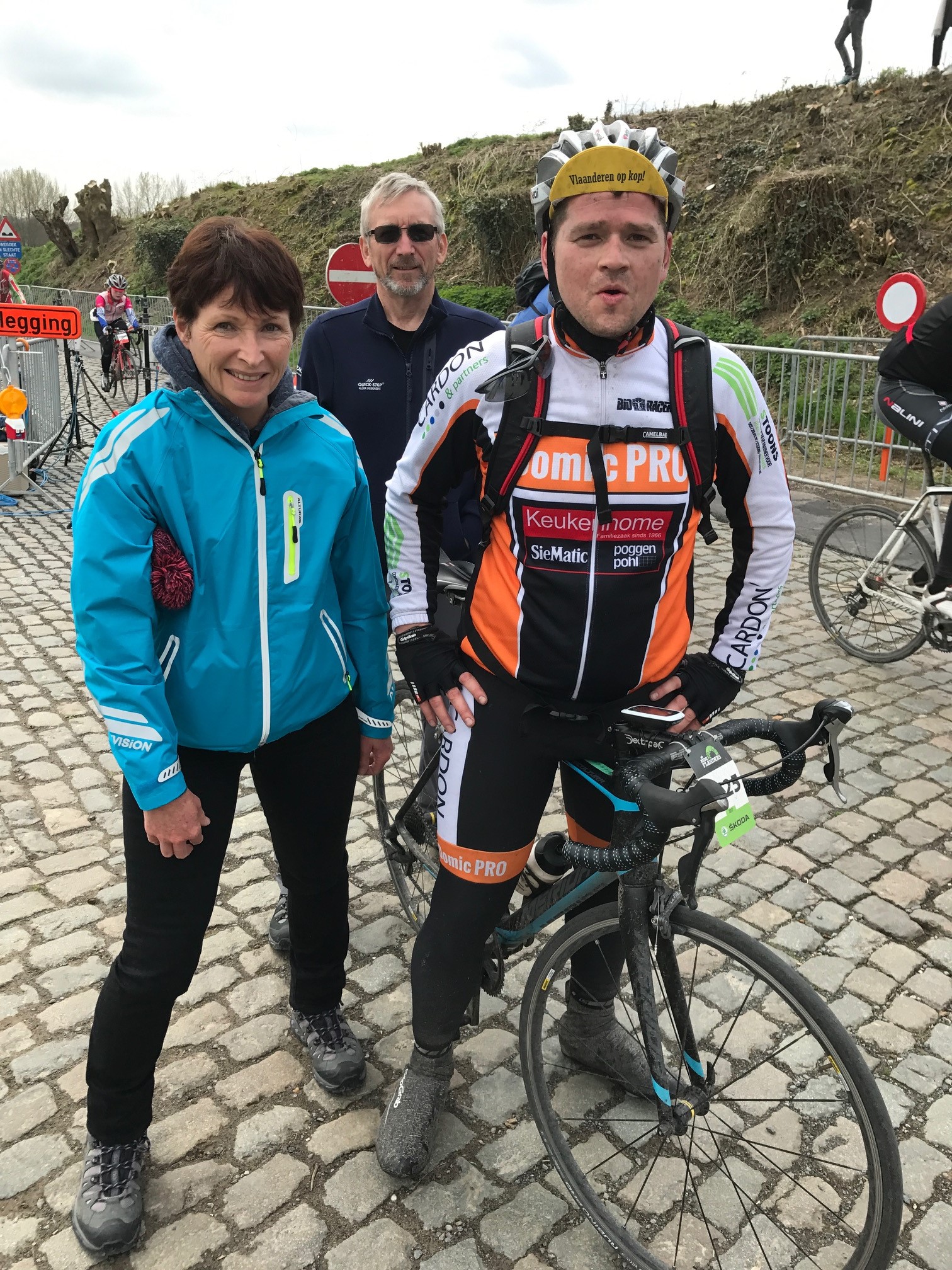Ronde Van Vlaanderen Cyclosportive 17 - Sue & Graham Tierney greet Maarten Verhulst at the top of the Eikenberg climb with 130k completed and 70k to go. The cyclosportive started in Antwerp in heavy rain and it stayed damp & cold most of the day. Just after this picture was taken Maarten snapped his chain which was replaced by Flanders Cycles in Oudenaarde . 