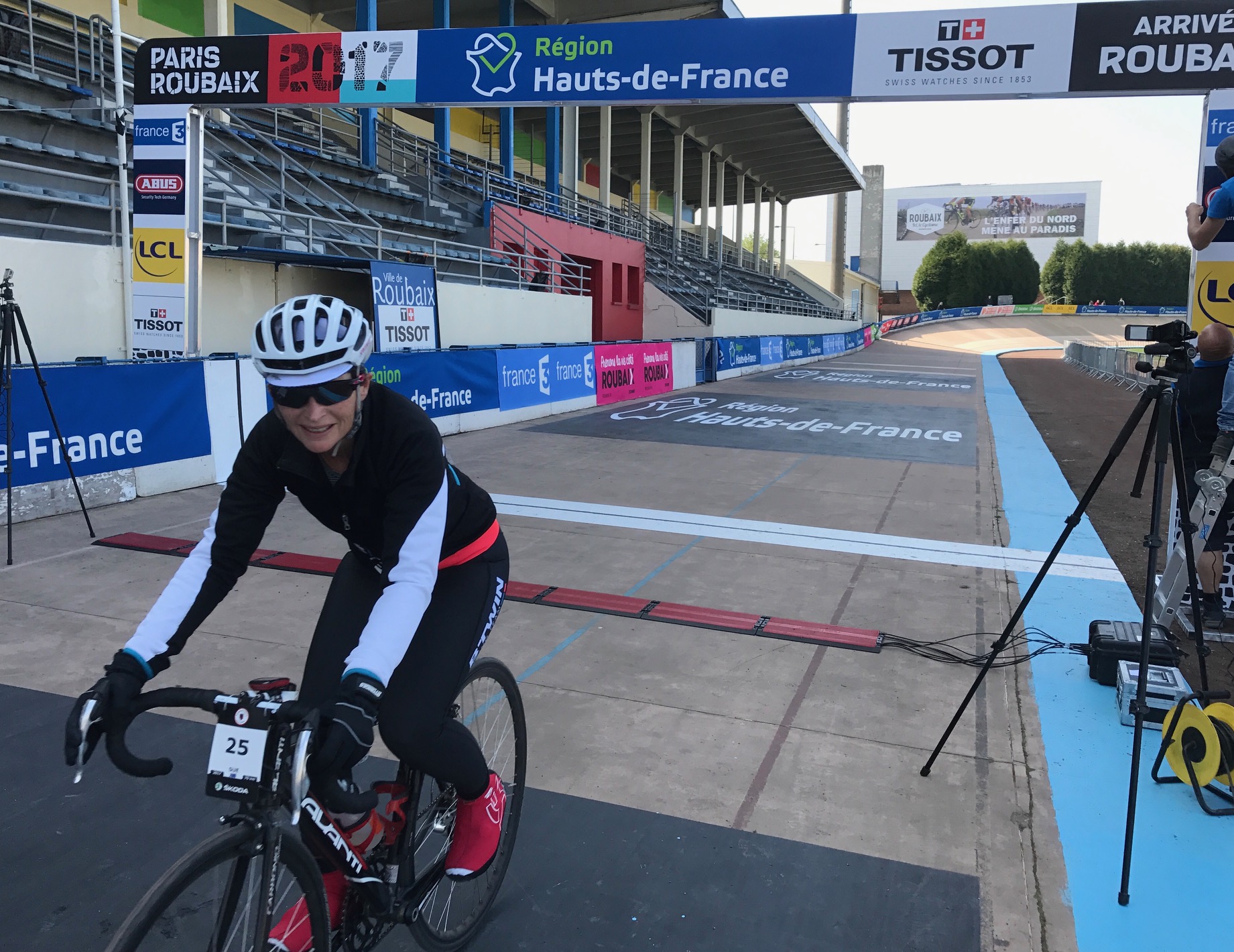 Paris Roubaix Cyclosportive 17 - Sue Tierney crosses the finishing line of the Roubaix Velodrome