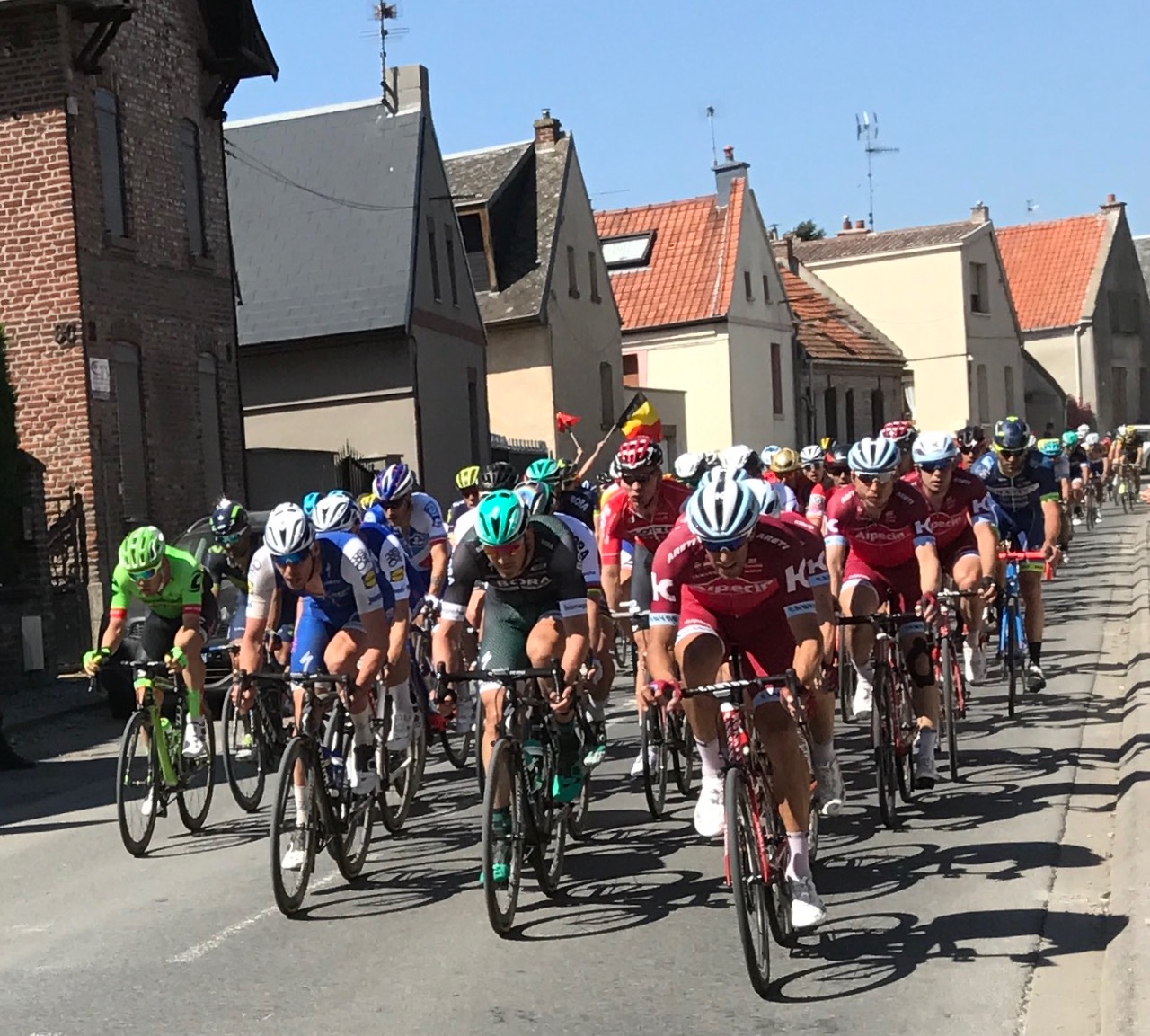Paris Roubaix 17 - Having the PR peloton come in from one side of Viesly it was a brisk 500m walk to see the same PR peloton come into Viesly from the other side of the village. Viesly village part 2 featured Peter Sagan (obscured) tucked behind a BORA team mate. Tom Boonen is also tucked behind a QS team mate.