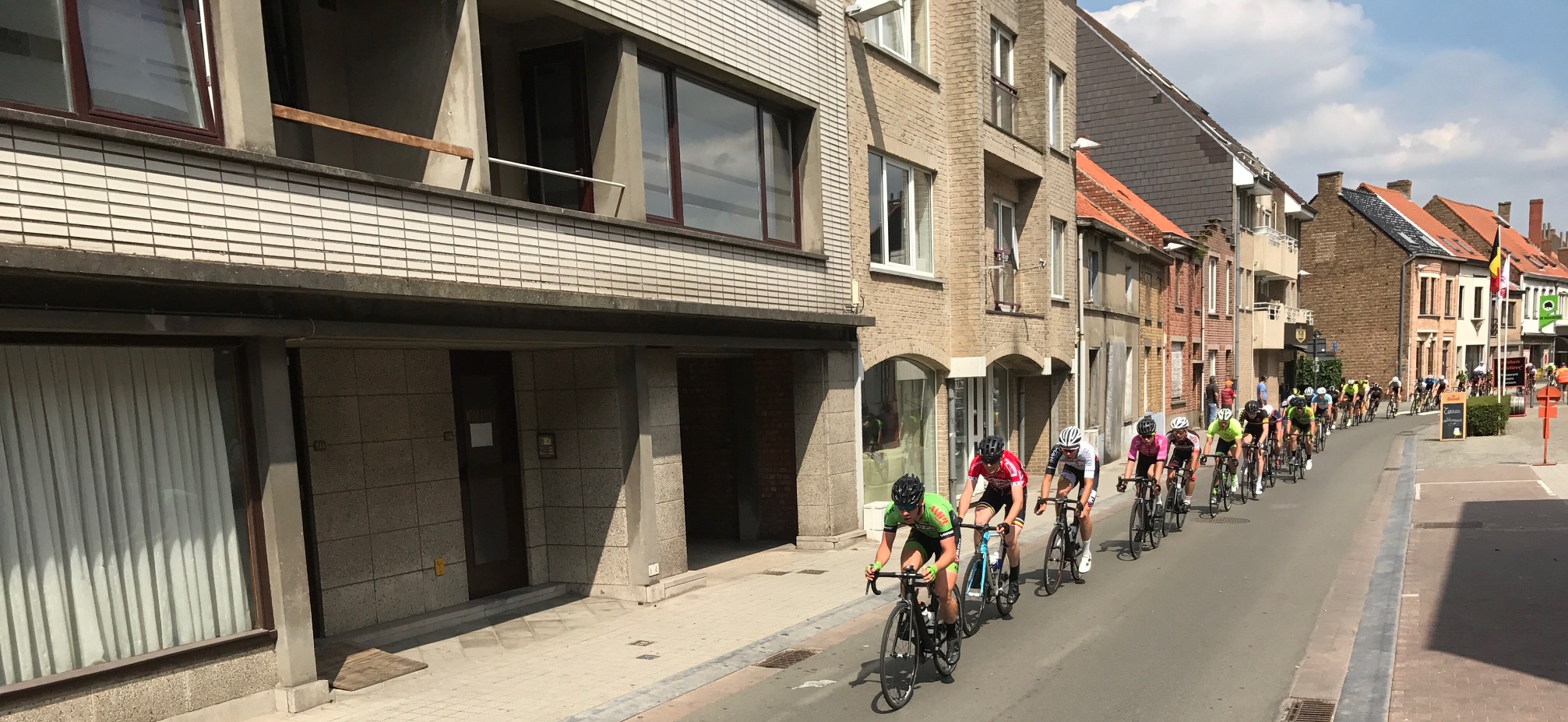 Gistel 17 - Peter (second in line) in the main peloton chasing the breakaway on lap 3. The circuit was highly urbanised and you can't help but be astounded as to where these Belgies actually run a bike race