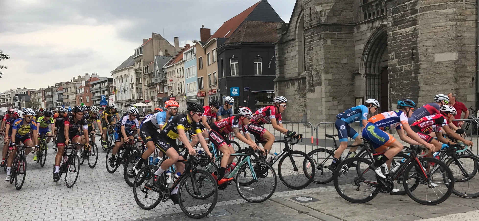 Deinze 17 - The only time for Peter Livingstone (red jersey black helmet) to pass the Deinze Church as a puncture after just 4k ended the day before it even started.