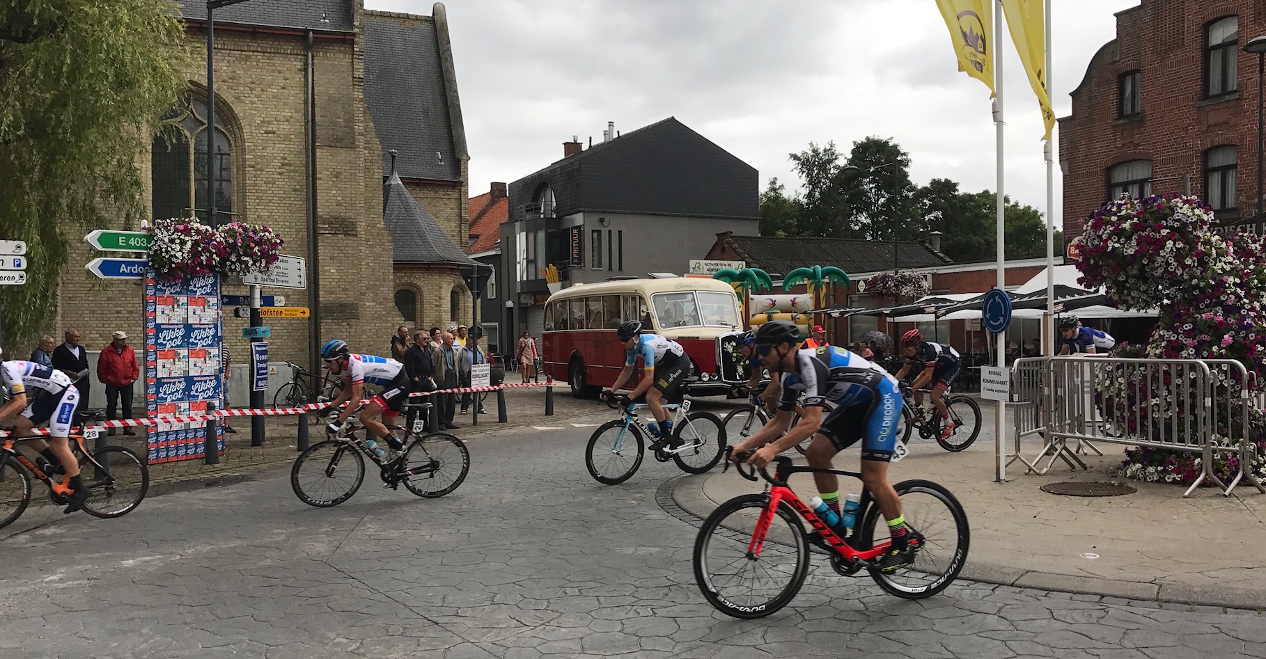Beveren 17 - A super fast & difficult kermesse with some light showers to complicate the effort. A near crash on lap 1 had Peter at the back of the peloton as the break of the day escaped, and escaped they remained. Peter attacked all day and finally finished an excellent 21st from 61 starters. This was the last of the Belgian single day kermesses with just the Tour of East Flanders to come. Peter (in light blue jersey above) passes in front of a Belgian bridal bus as the wedding party is about to depart the Beveren church. 