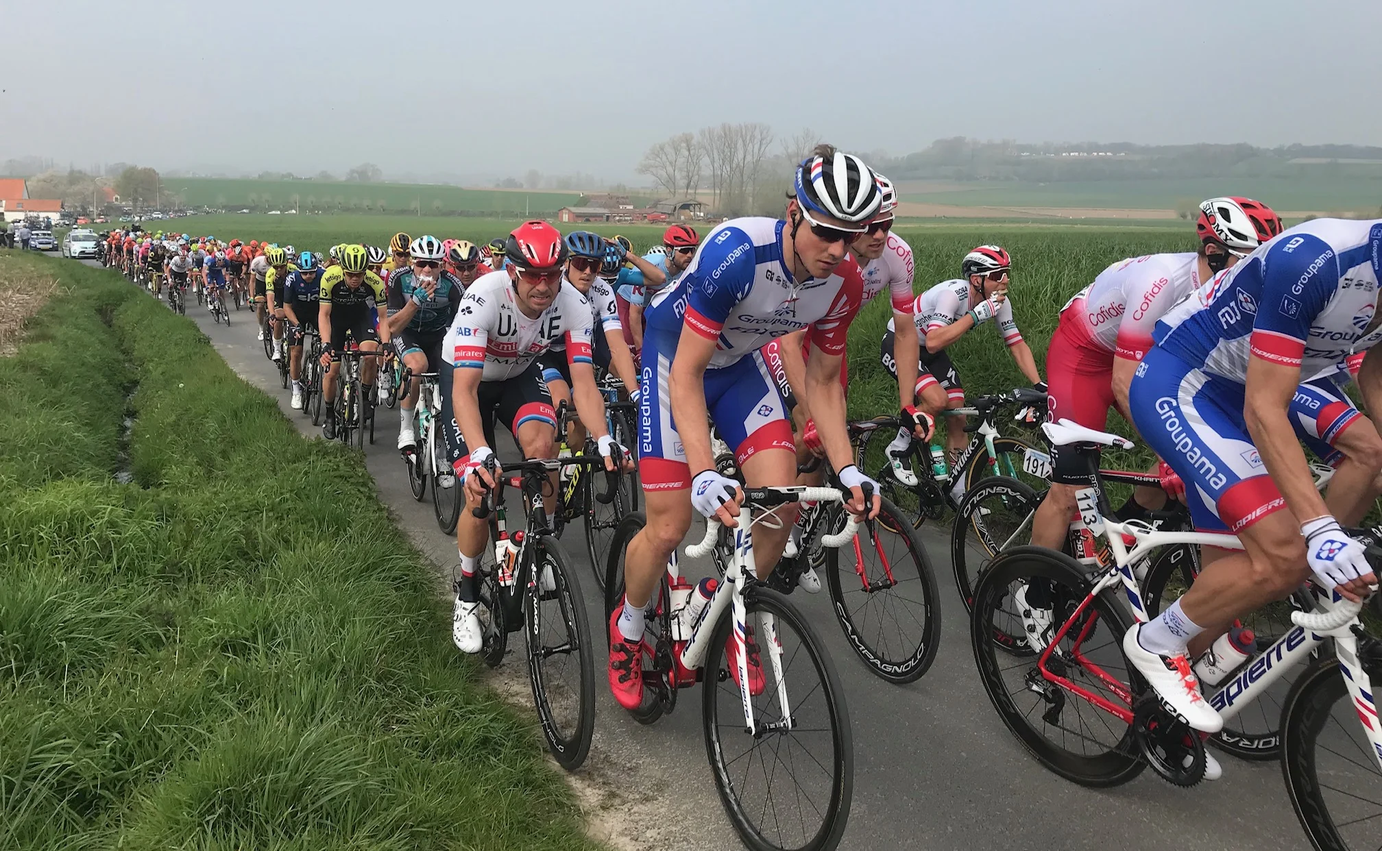 RVV @ 7 April - Alex Kristoff (UAE, red helmet) climbs the Kortekeer climb. Photo MO’R