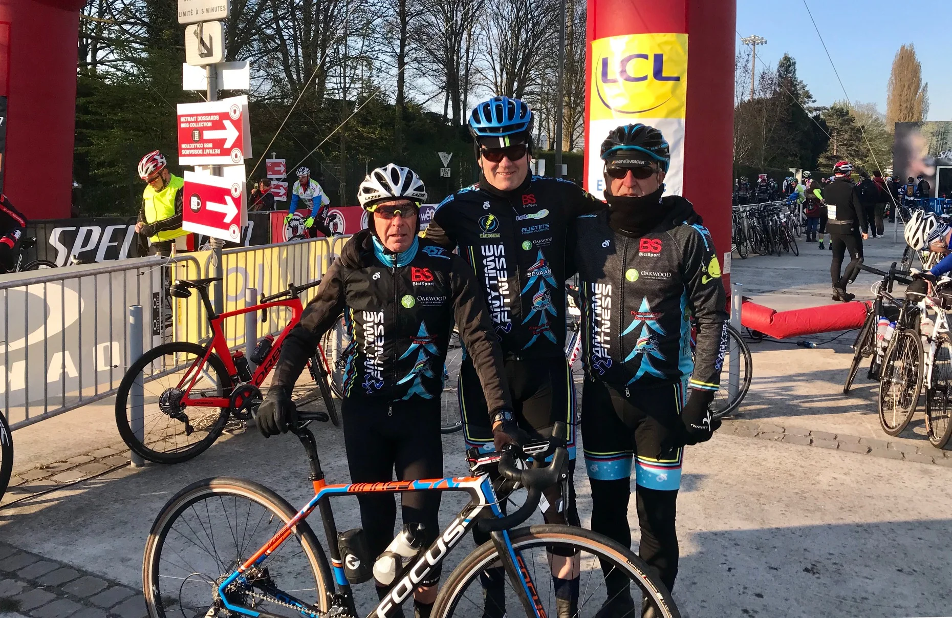 Paris Roubaix Cyclosportive @ 13 April - Starting outside the Roubaix Velodrome with the temperature sitting on 0 degrees with Mike(s) Lawson, O’Brien & O’Reilly Paris Roubaix Cyclosportive Ride Report @ 13 April The weather was delightful with no rain, no wind and starting temperatures of 0 degrees (the day maxed out at 9 degrees). Yes, it was chilly but blue sky promised a great day. The early kilometers were straightforward enough on flat & good bitumen roads. The first feed zone came after 40k and immediately afterwards it was cobble time. The story goes like this - Templeuve (you’re joking, it wasn’t even a road !), Cysiong (ok, not bad), Bourghelles (maybe not ok, but we got there), Camphin en Pevele (what is the French word for crap ?), Carrefour De L’Arbre (bad as advertised, but not as bad as remembered), Gruson (simple enough) & Hem (that was total shit, awful, you can’t be serious). The final run into Roubaix from Hem carried more Saturday traffic than expected but the reward was the ceremonial lap around the classic Roubaix Velodrome. Do it all again in 2020 ? … in a heartbeat.