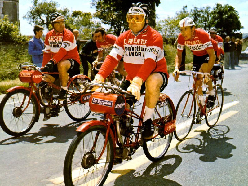 Bordeaux Paris 1968 - Belgian Herman Van Springal races behind his designated team derny for the 600k race. The first 300k of the Bordeaux Paris race was ridden as a steady group ride, then riders stopped briefly. The last 300k was then raced “full gas” behind the derny - each rider had their own derny. The derny machines were notoriously unreliable (no surprises there !) and the spare team derny on the right of this picture was there just in case something went wrong. Note - the “bigger” the derny driver the better !