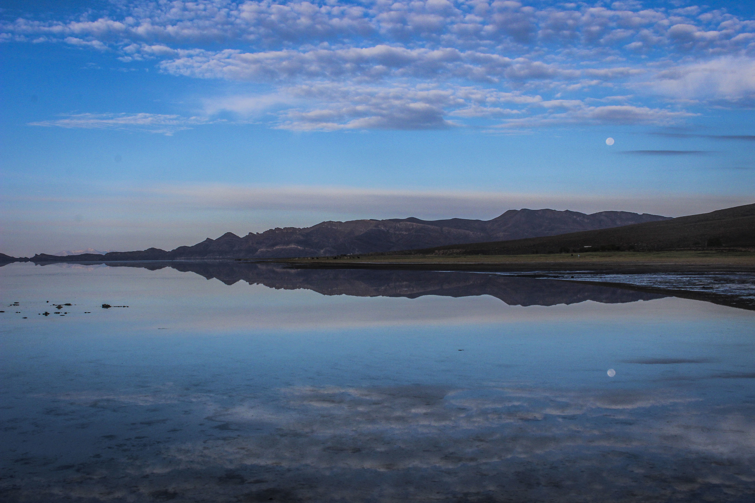 The famous mirror effect after a night of rain in the Salar de Uyuni, Bolivia. 