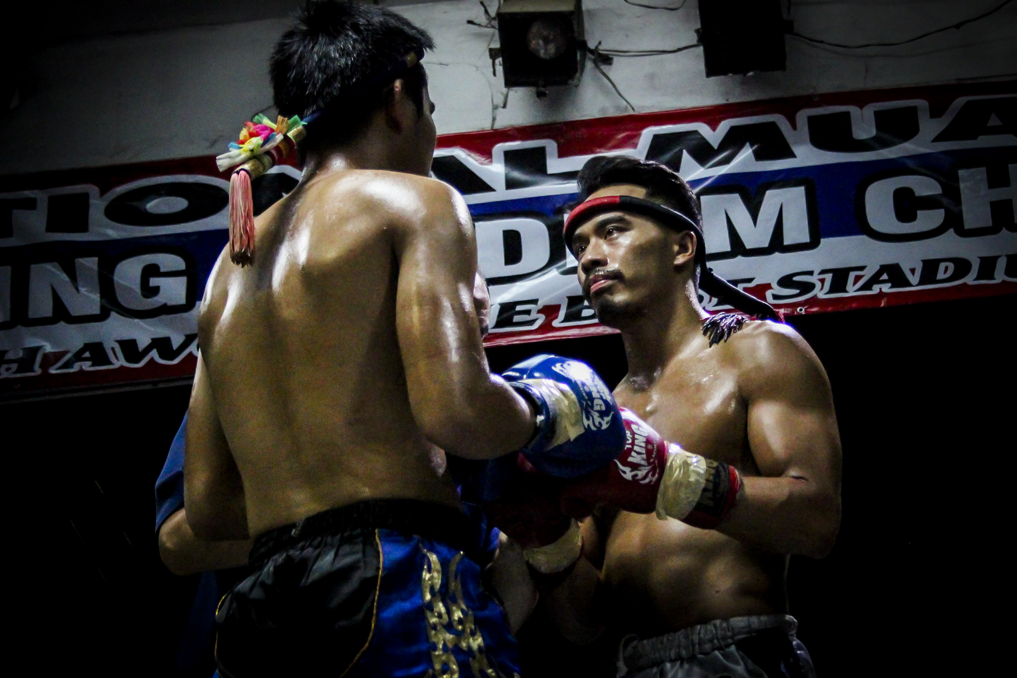 The fighters tap gloves. 