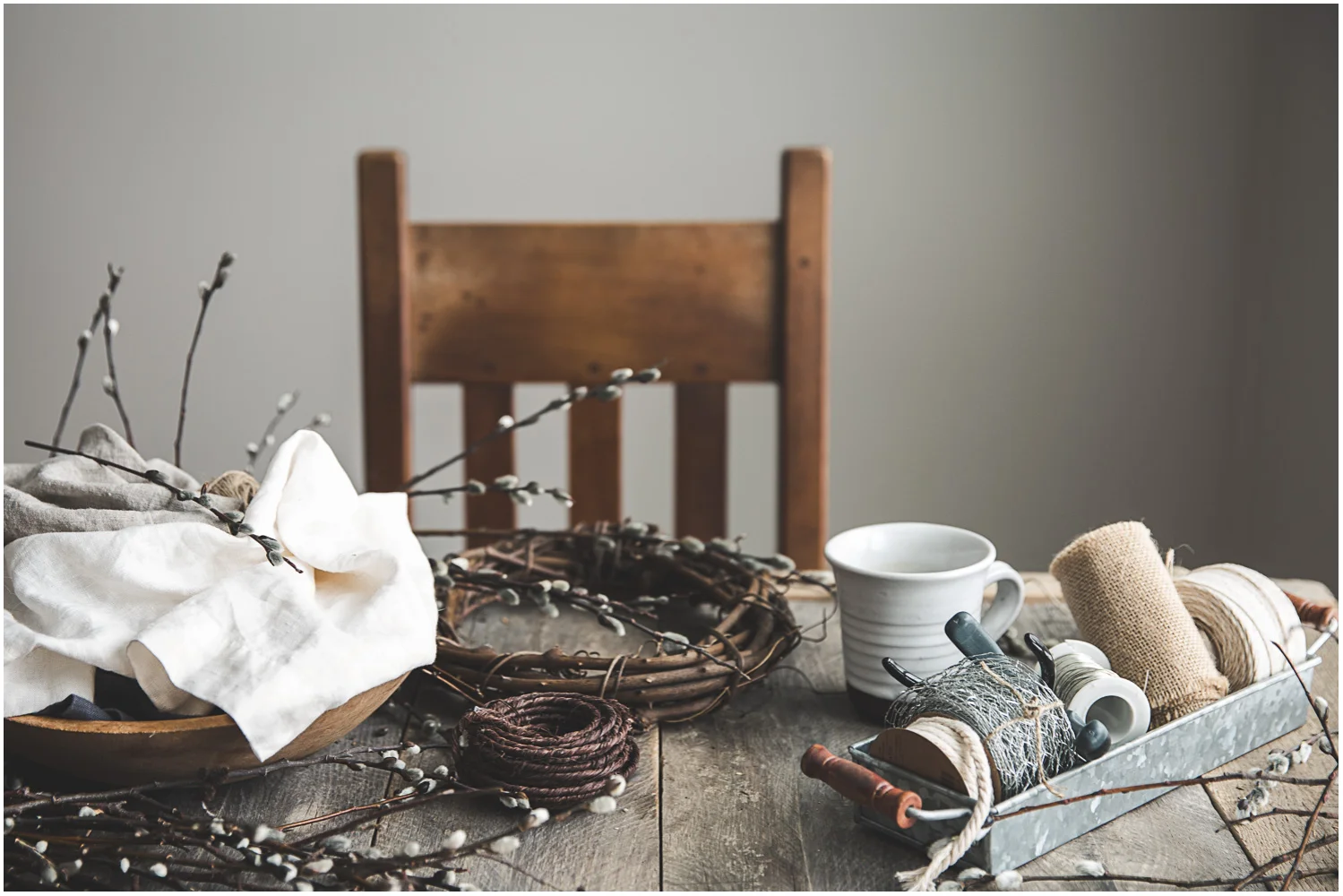 Wreath-making supplies, including the requisite cup of hot coffee