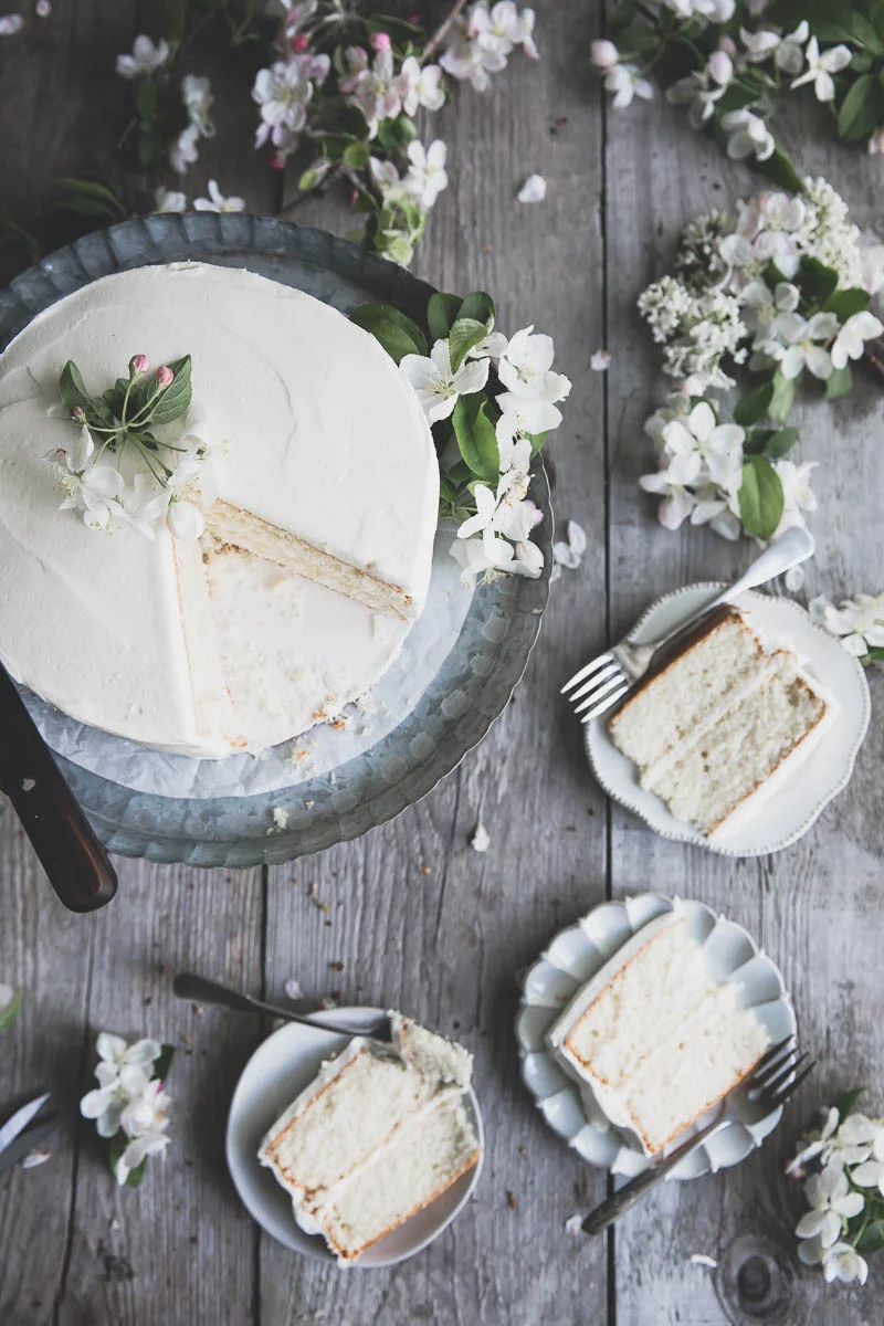 Classic white cake decorated with apple blossoms
