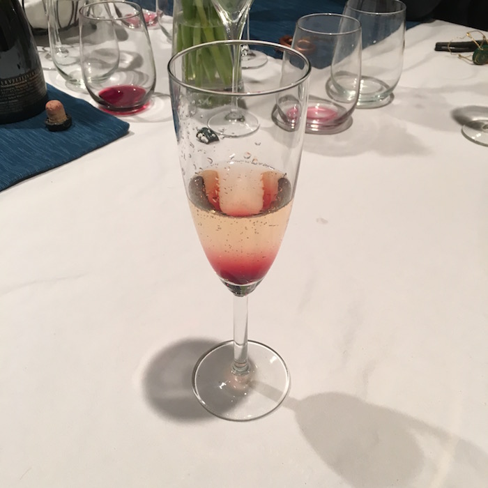 Dropping a hint of Creme de Cassis into a glass of sparkling wine looks so great that it's bound to get you a next date.