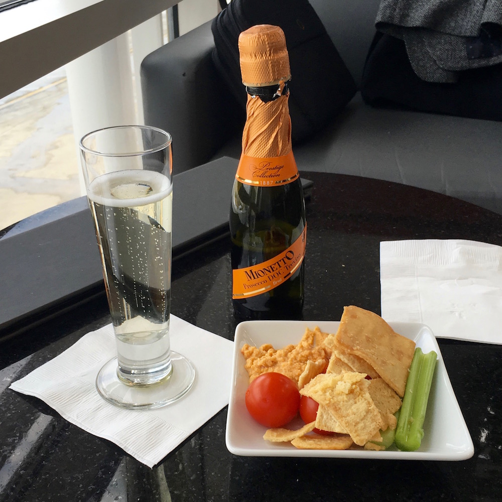Chips, veggies, hummus, and a glass of sparkling wine make the perfect anecdote to an otherwise hectic day on the road.
