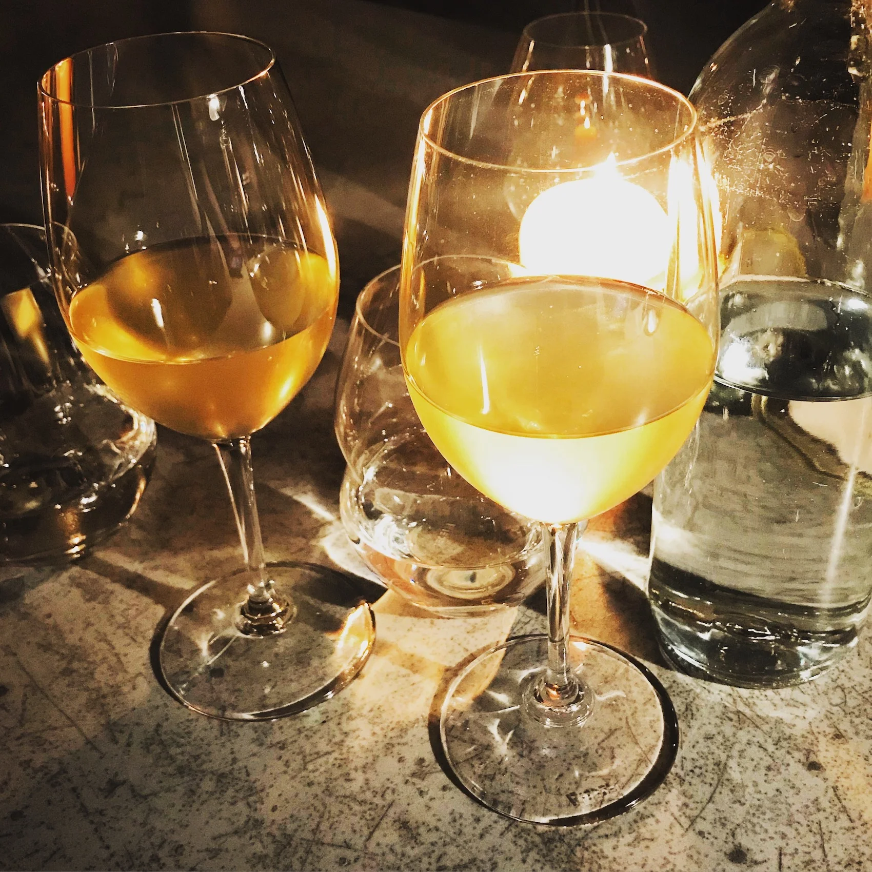 Soft candlelight at Bokovka refracted beautifully through glasses of the Dobrá Vinice Crème de Parc National.