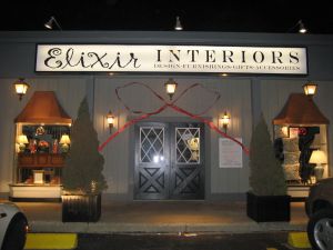 elixir_sign_at_night_red_bow_c7lv.jpg