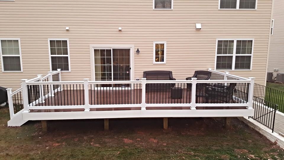 Rosewood Deck with White Railings and Black Balusters