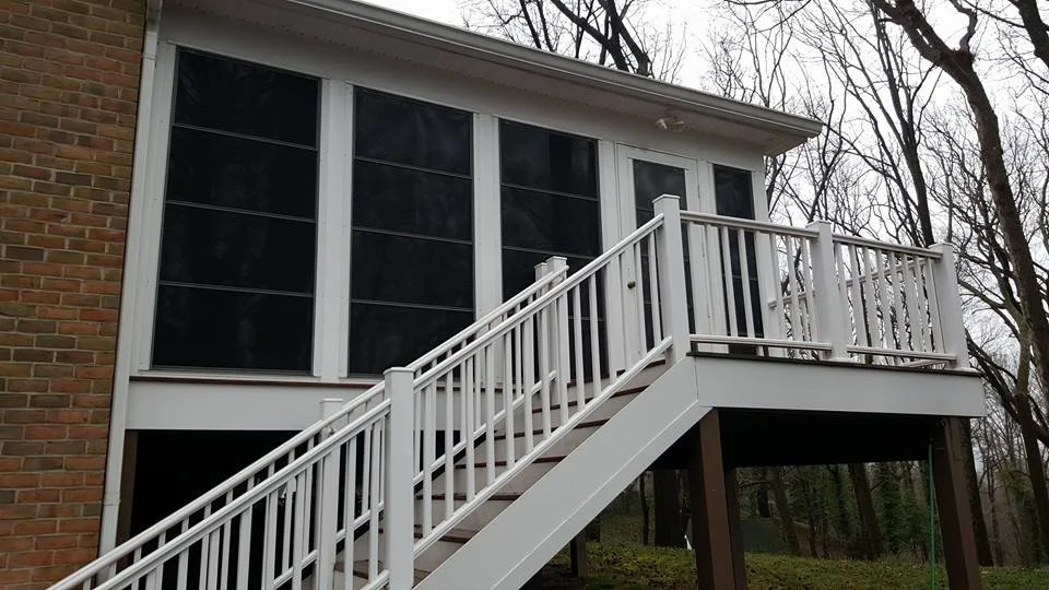Covered Porch with White Staircase