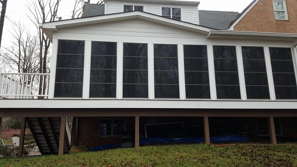 Covered porch with 4 track windows