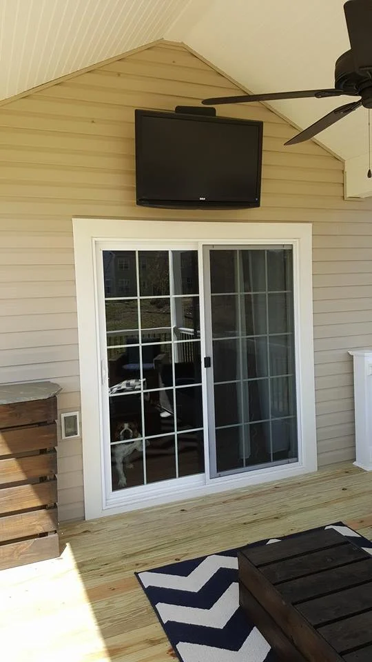Covered deck with remote controlled ceiling fan and TV with cable