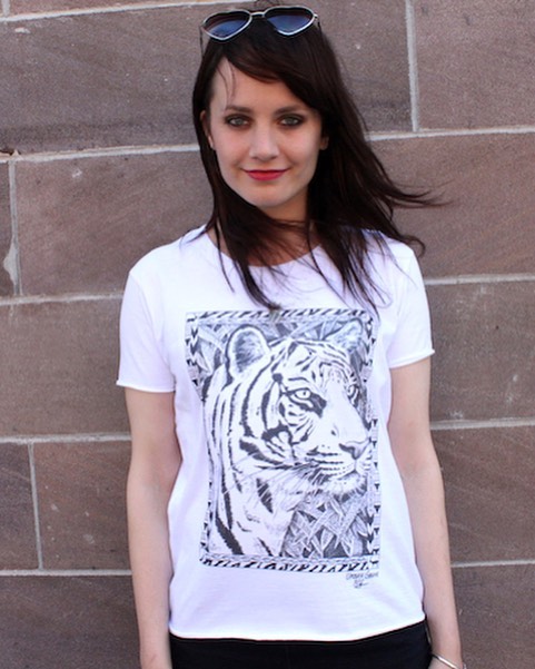 It&rsquo;s #globaltigerday! Make a difference by what you wear. Every purchase of our hand drawn tiger shirt gives back $5 to help @natgeo #savebigcats. Shop link in bio. #tigers #causeanuproar 🐯Design by @marnie_art