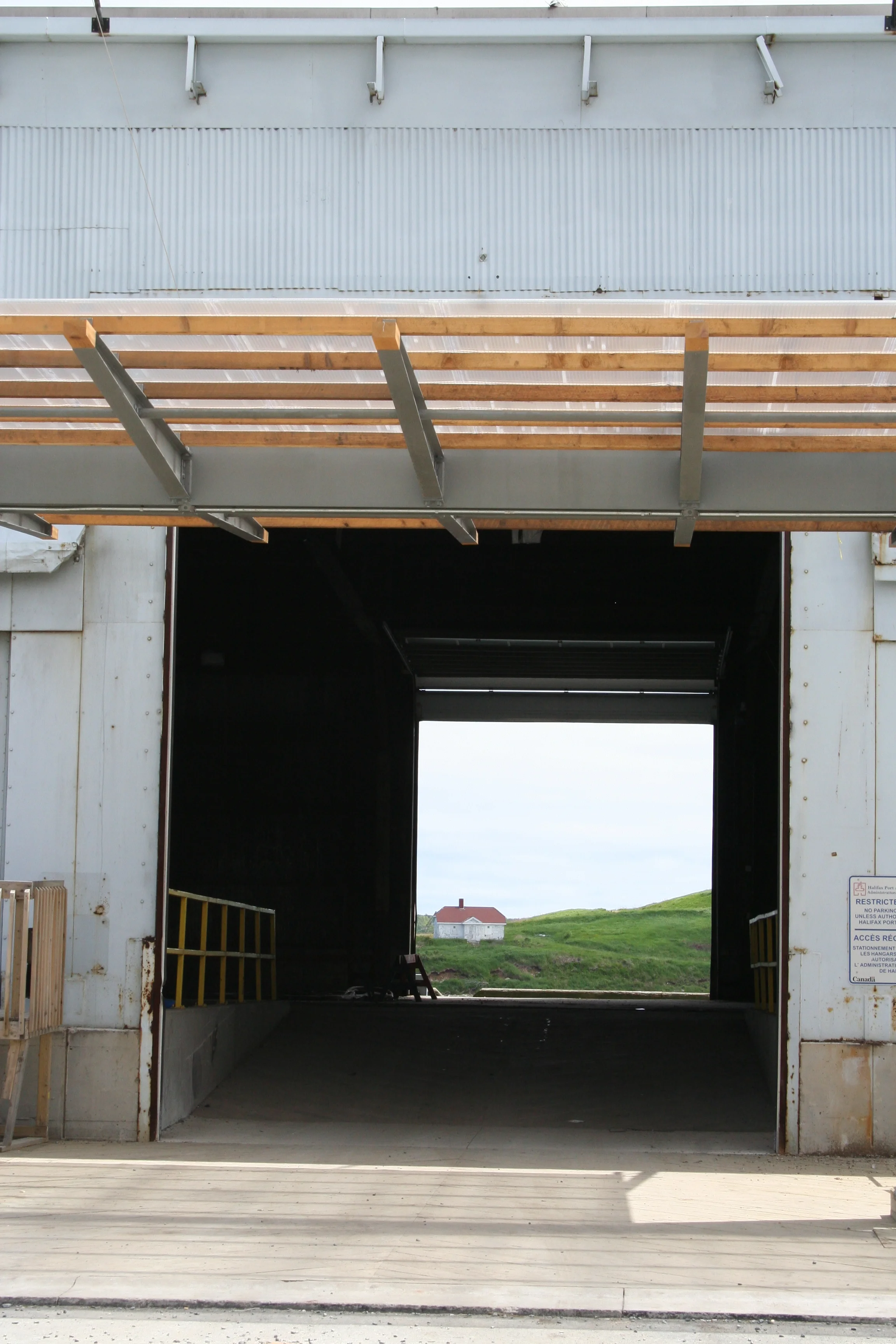 View of Georges Island in Halifax Harbour through abandoned hangar, Nova Scotia (Canada) (© Christophe Rivet