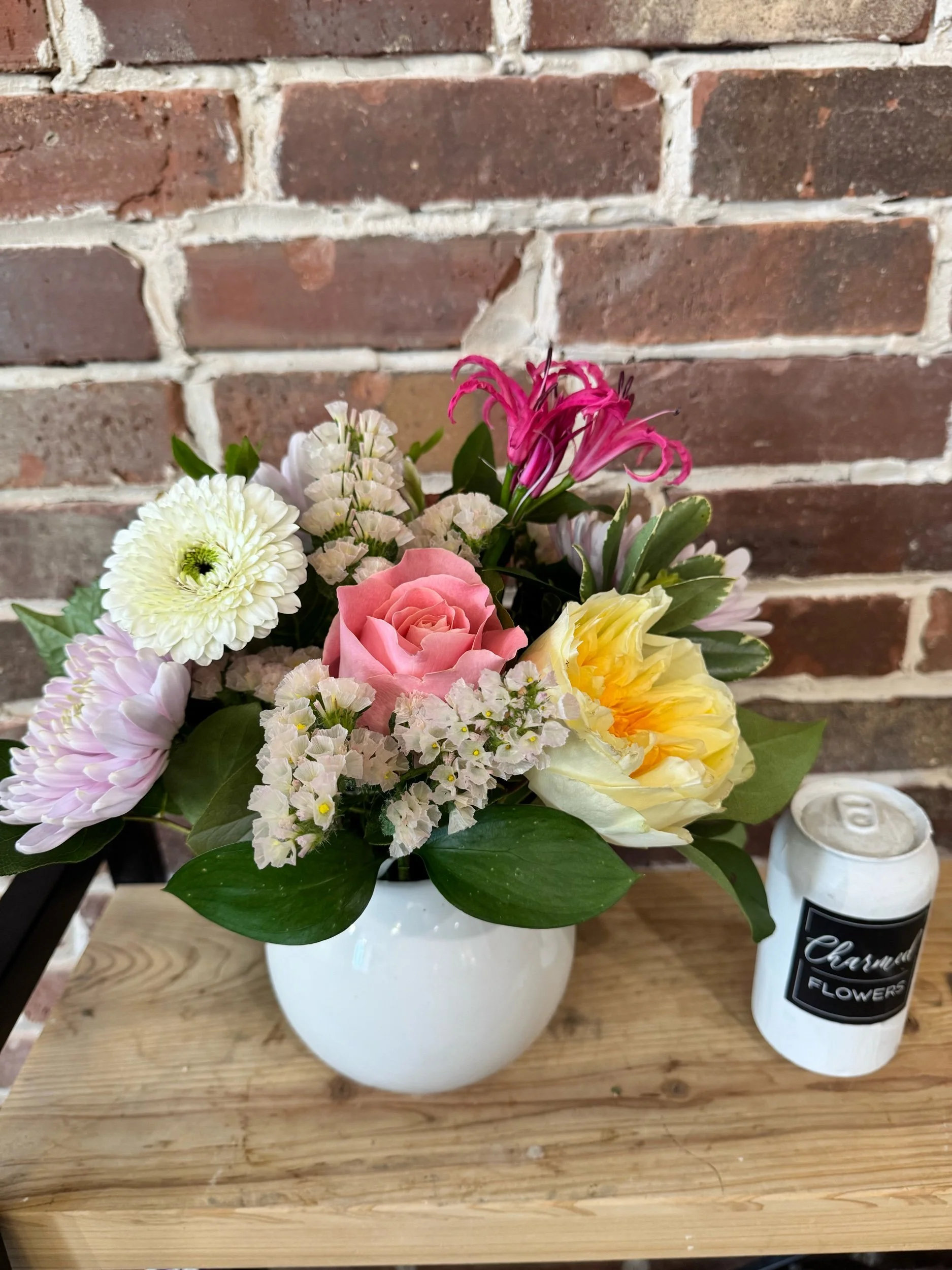The Enchanted Garden Arrangement, colourful, pastel and in a white vase. Mom's favourite