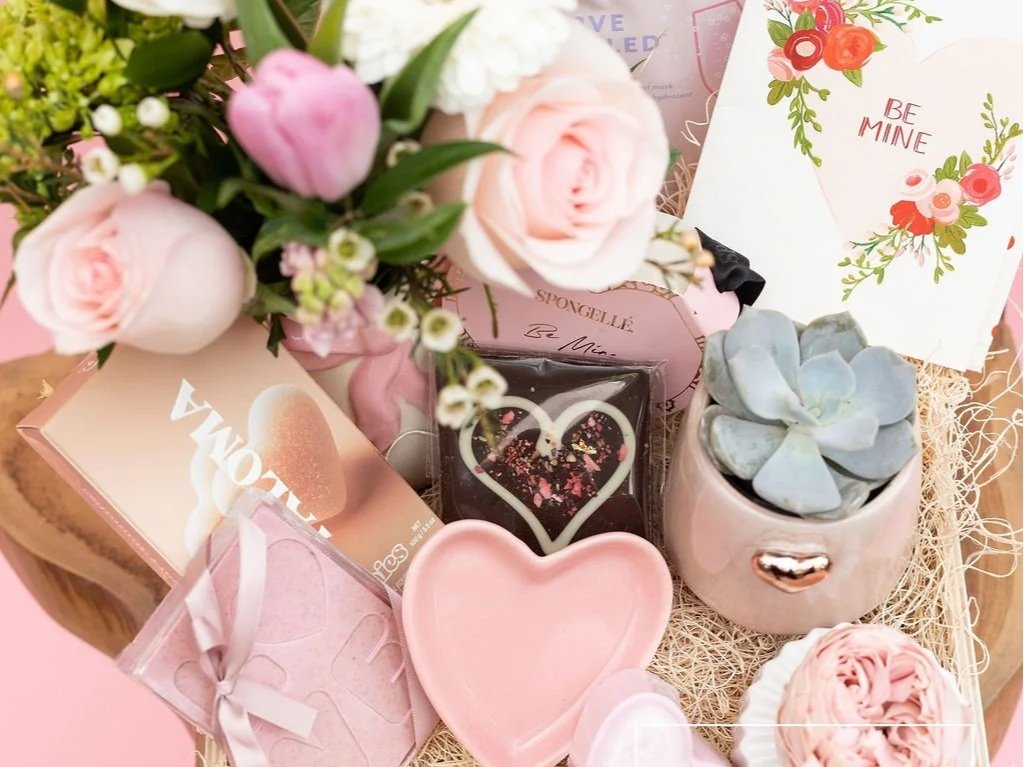 The Sweethearts Bundle includes fresh flowers along with an Enduring Love rose with snacks, bath and body products and a trinket dish.