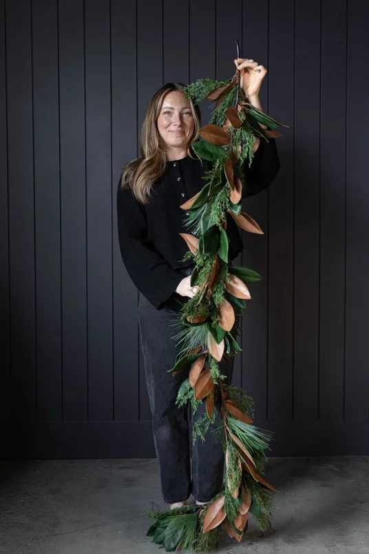 6ft Magnolia Norfolk Cypress Mixed Real Touch Garland - Woman holding for refrence