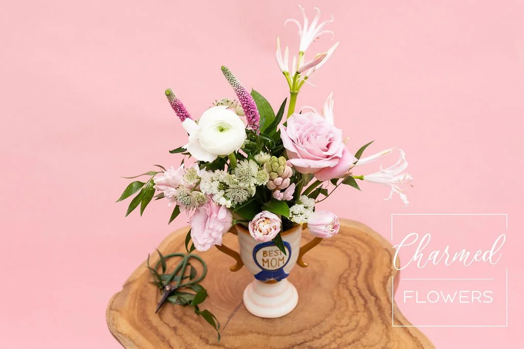 And The Best Mom Award goes to. . . You! Beautiful pink arrangment in a speacitly trophy vase. Waterloo Florist, Charmed Flowers