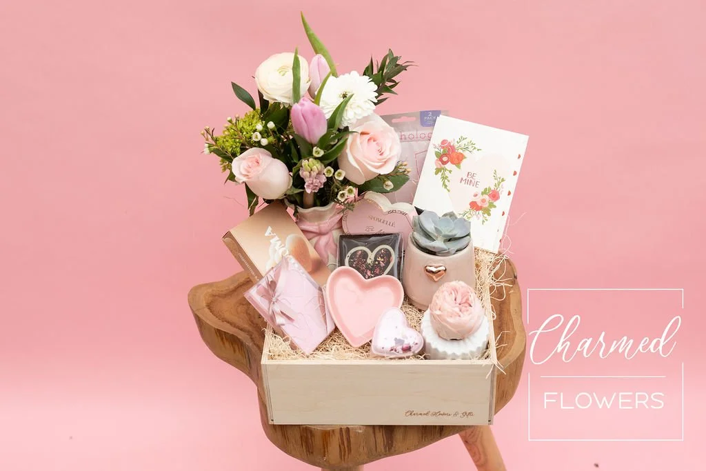 The Sweethearts Bundle includes fresh flowers along with an Enduring Love rose with snacks, bath and body products and a trinket dish.