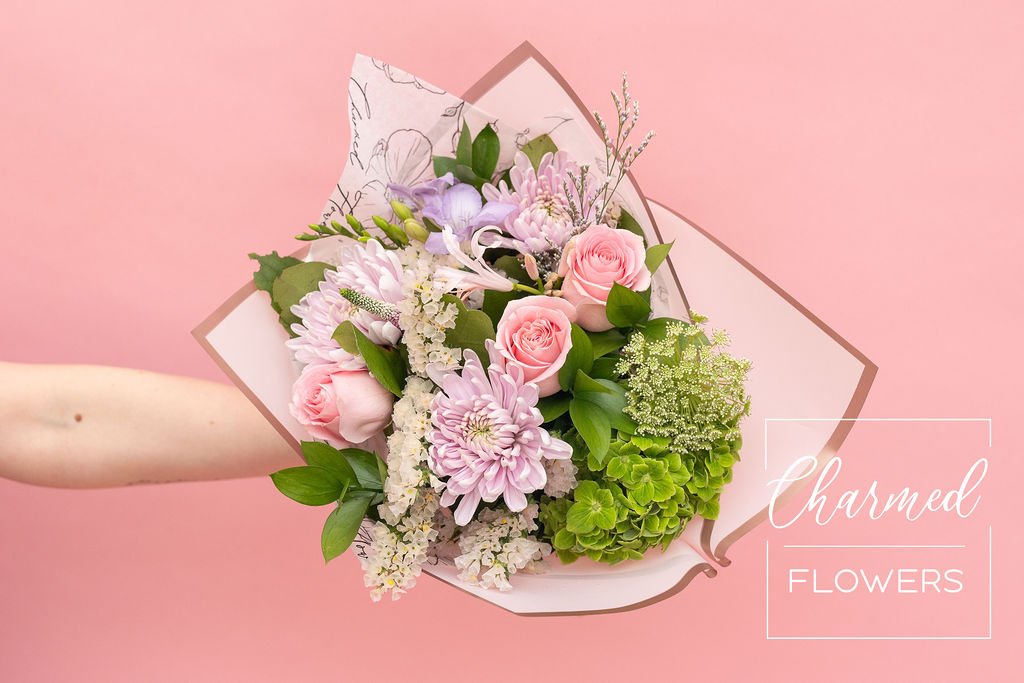 The Enchanted Garden Bouquet, perfect pastel pinks and prurples. Wrapped in eye catching specialty pink papers