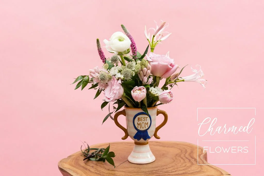 And The Best Mom Award goes to. . . You! Beautiful pink arrangment in a speacitly trophy vase. Waterloo Florist, Charmed Flowers