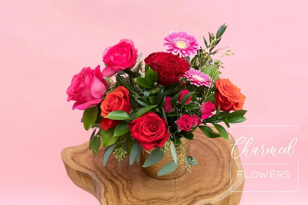 The Wild Thing Vase Arrangment has a stunning red and pink colour pallete for a dramatic and romantic look. Arrangment is in a gold vase.