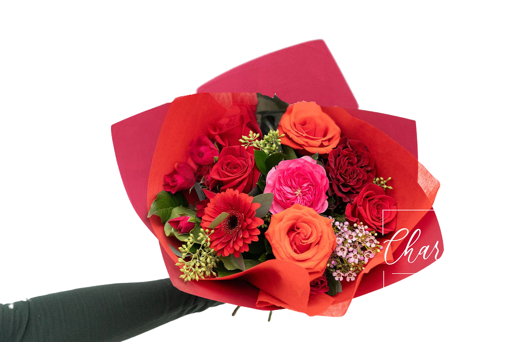 The Wild Thing Valentines Day Bouquet includes red and orange Roses, Gerbera Daisy, and filler flowers