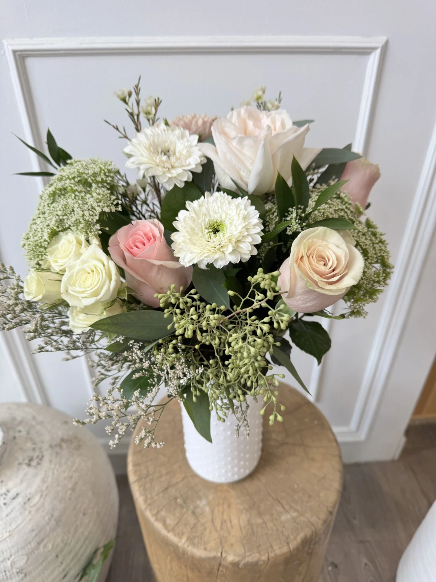 The Sweet Thing Arrangment. A soft romantic bouquet in a vase in pastel pinks, cream, peach, white.