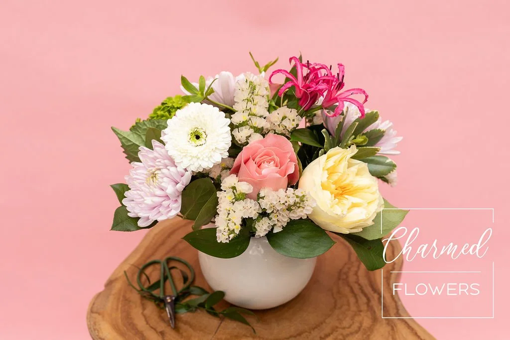 The Enchanted Garden Arrangement, colourful, pastel and in a white vase. Mom's favourite