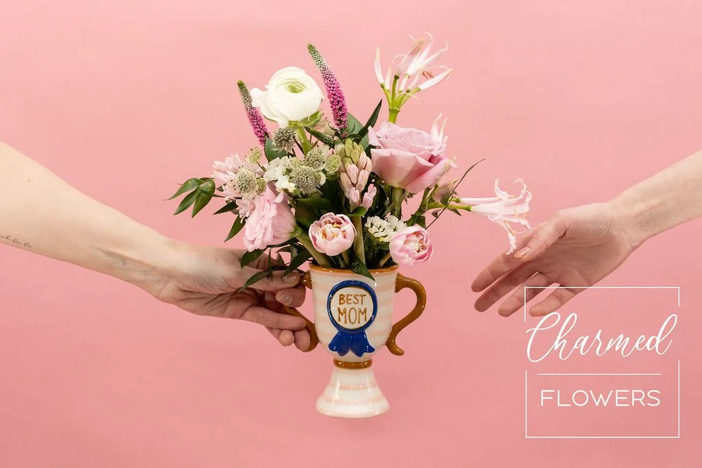 And The Best Mom Award goes to. . . You! Beautiful pink arrangment in a speacitly trophy vase. Waterloo Florist, Charmed Flowers