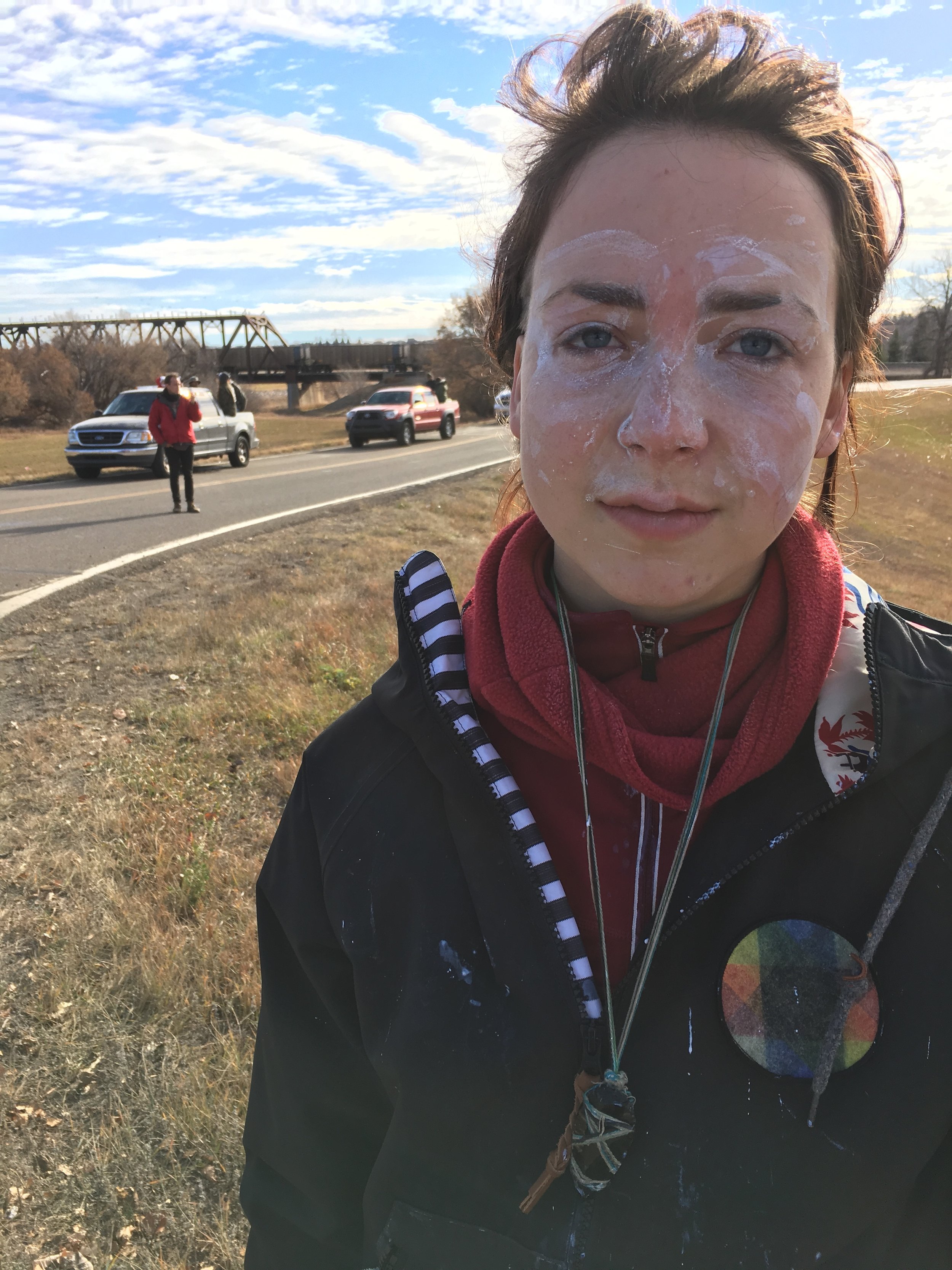 Gwen Frost is a student in Bellingham, Wash. She grew up in Portland, Ore. She was sprayed in the eyes at point-blank range with OC gas by police in Mandan, ND. Why? Because she is peacefully standing up for what she believes is right, and that goes against the interests of the biggest pile of money.
